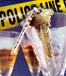 Keys in holiday drinking glass, in front of Police line