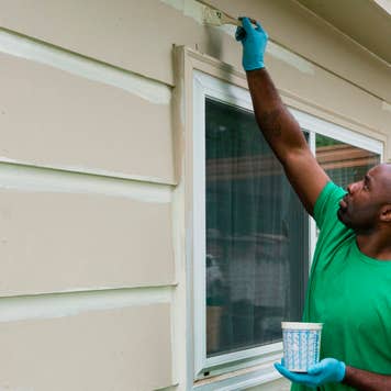 Man painting house