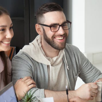 Man and woman talk with a banker