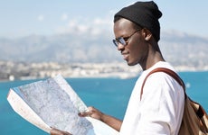 Student looks at a map while studying abroad