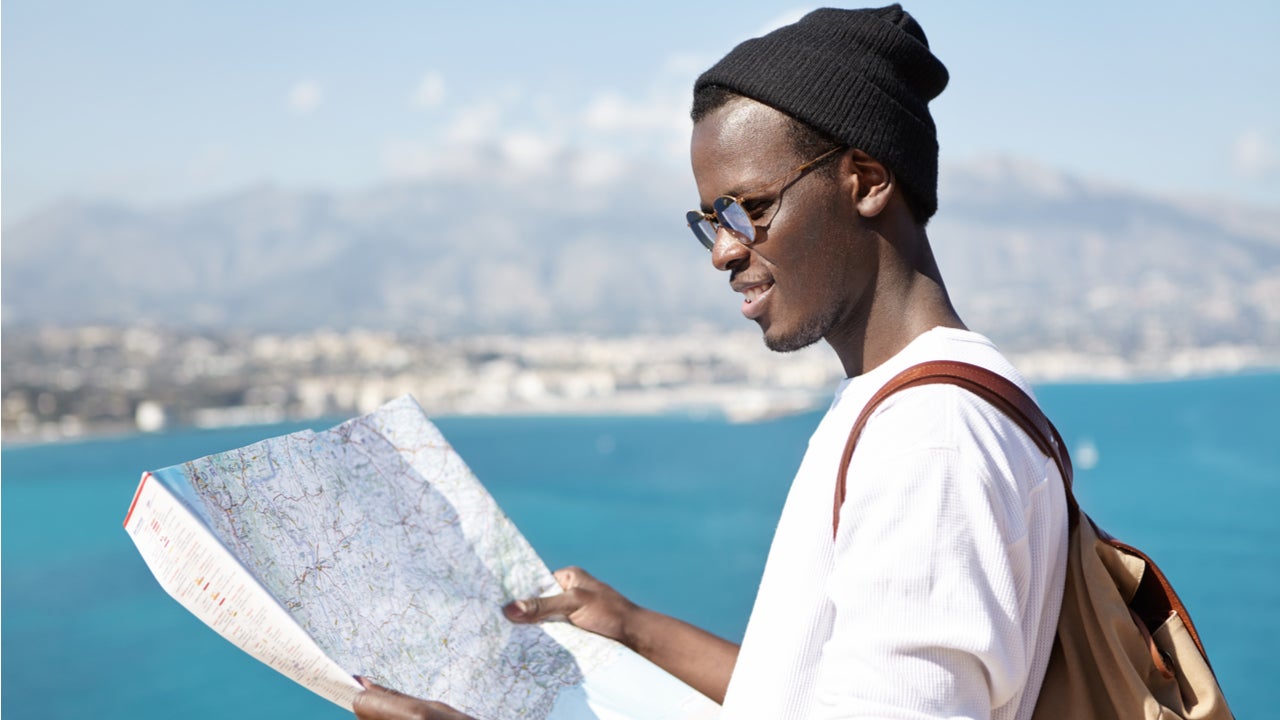 Student looks at a map while studying abroad
