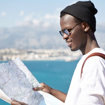 Student looks at a map while studying abroad