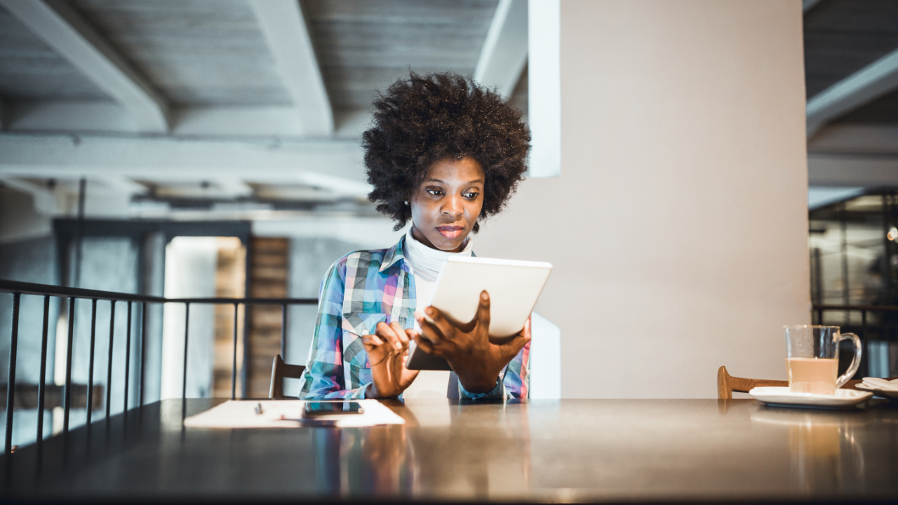 Woman doing work on her tablet