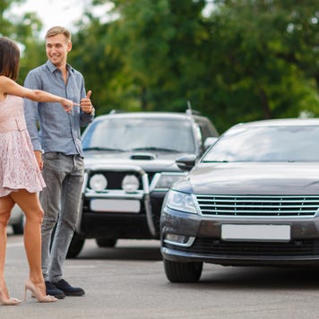 Couple shops for a new car