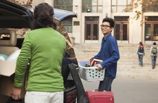 Parents help college student move into dorms