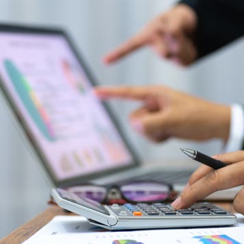 Two people working out a debt management plan