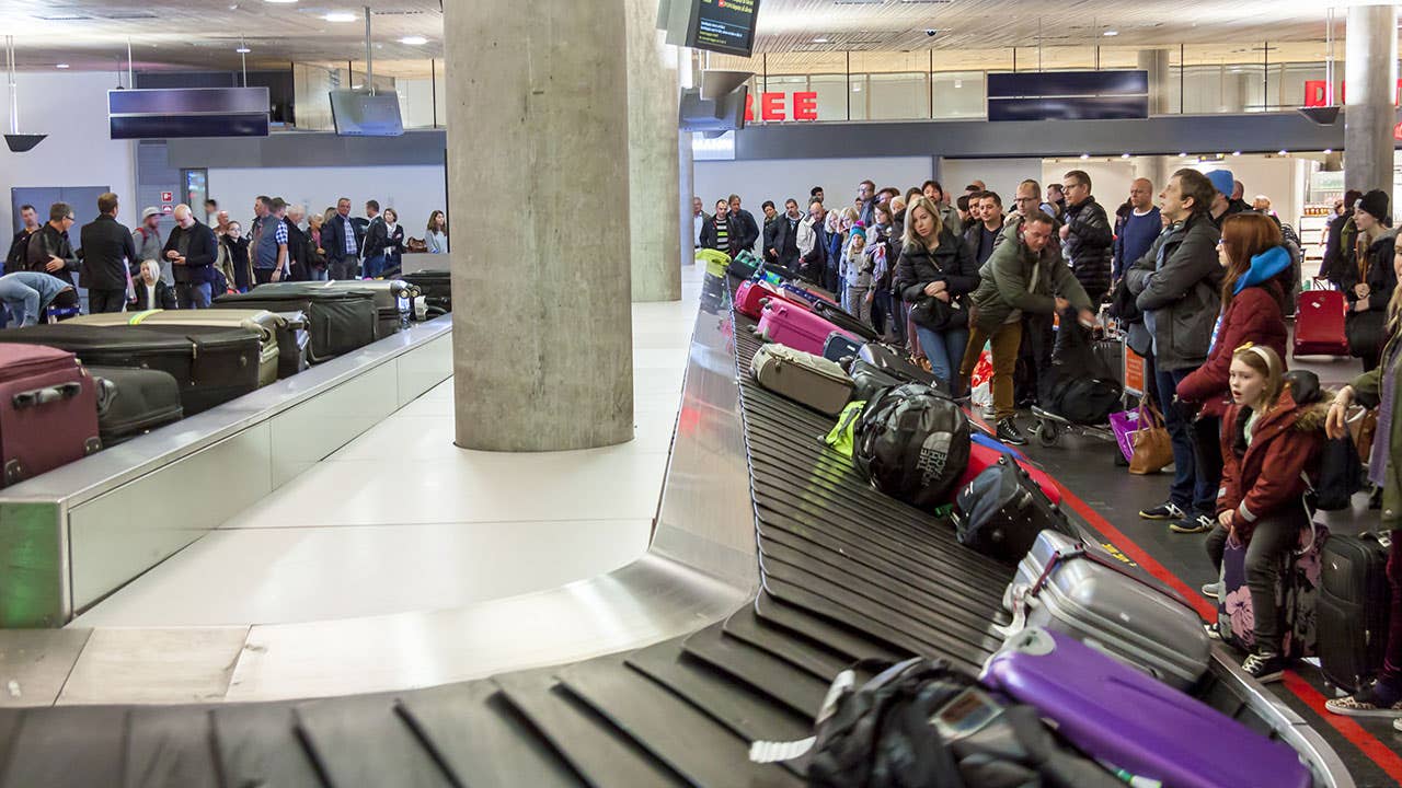 Passengers waiting for bags in baggage claim