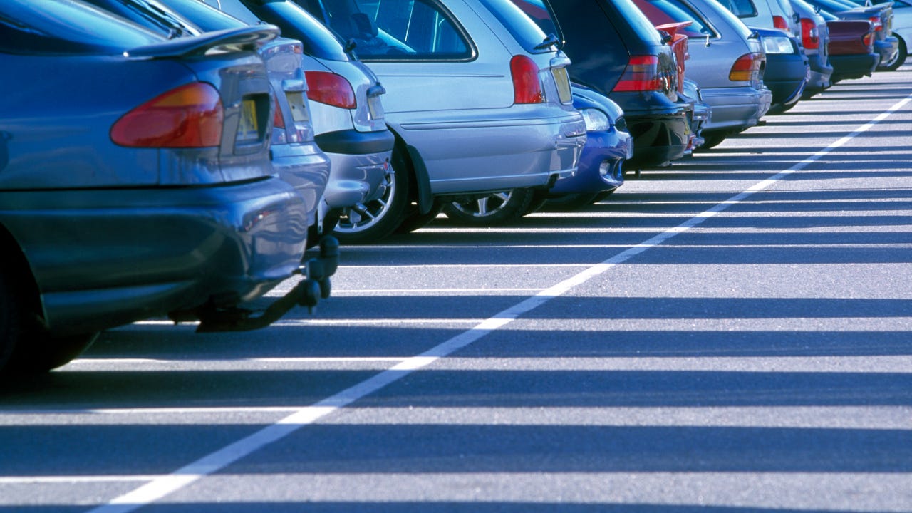 A line of cars positioned diagonally to the left