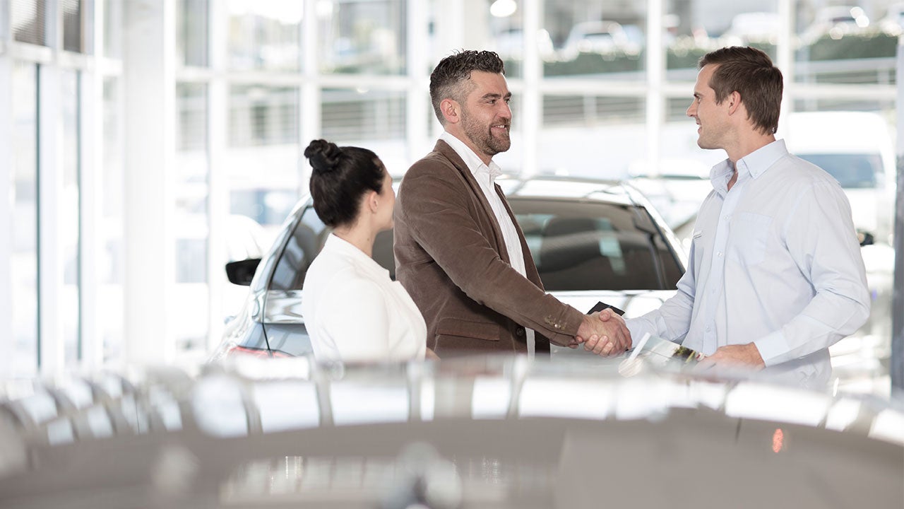 Car dealership with customers