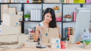 Woman packages orders for her small business