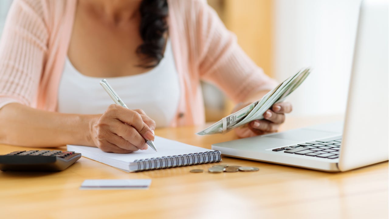 Woman calculating budget and payments