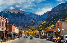 A look down Main Street in Telluride during Peak Autumn Color from the Aspens with a mountain backdrop