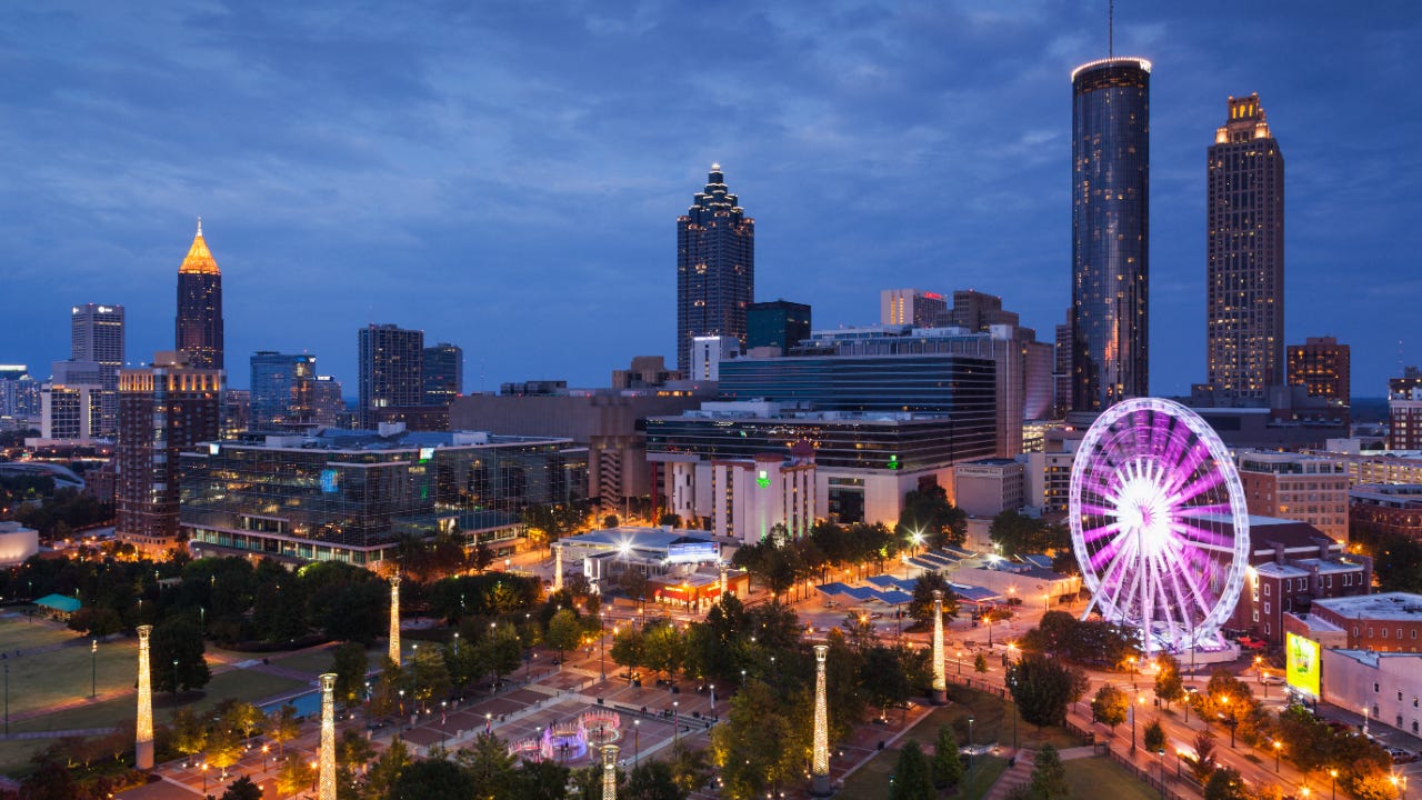 Atlanta, elevated city view with ferris wheel, dusk