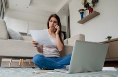 Woman at home complaining about on the phone