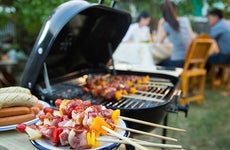 Hot dogs and kebabs on the grill © VectorLifestylepic/Shutterstock.com
