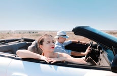 Couple drive in a convertible