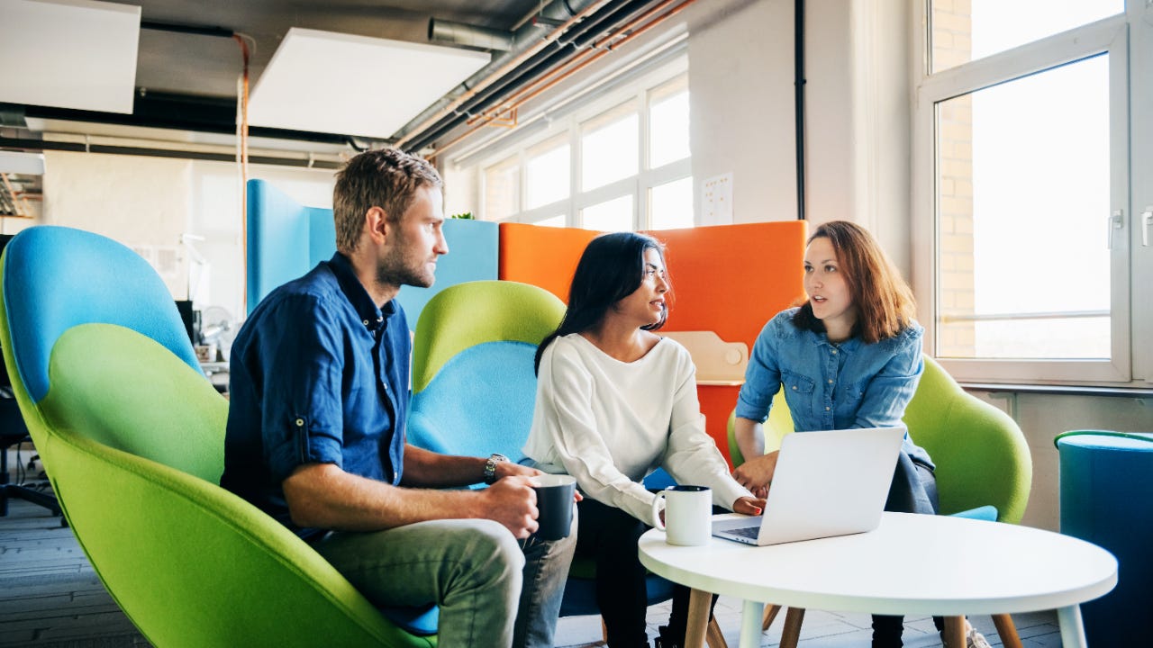 Three colleagues have a meeting.