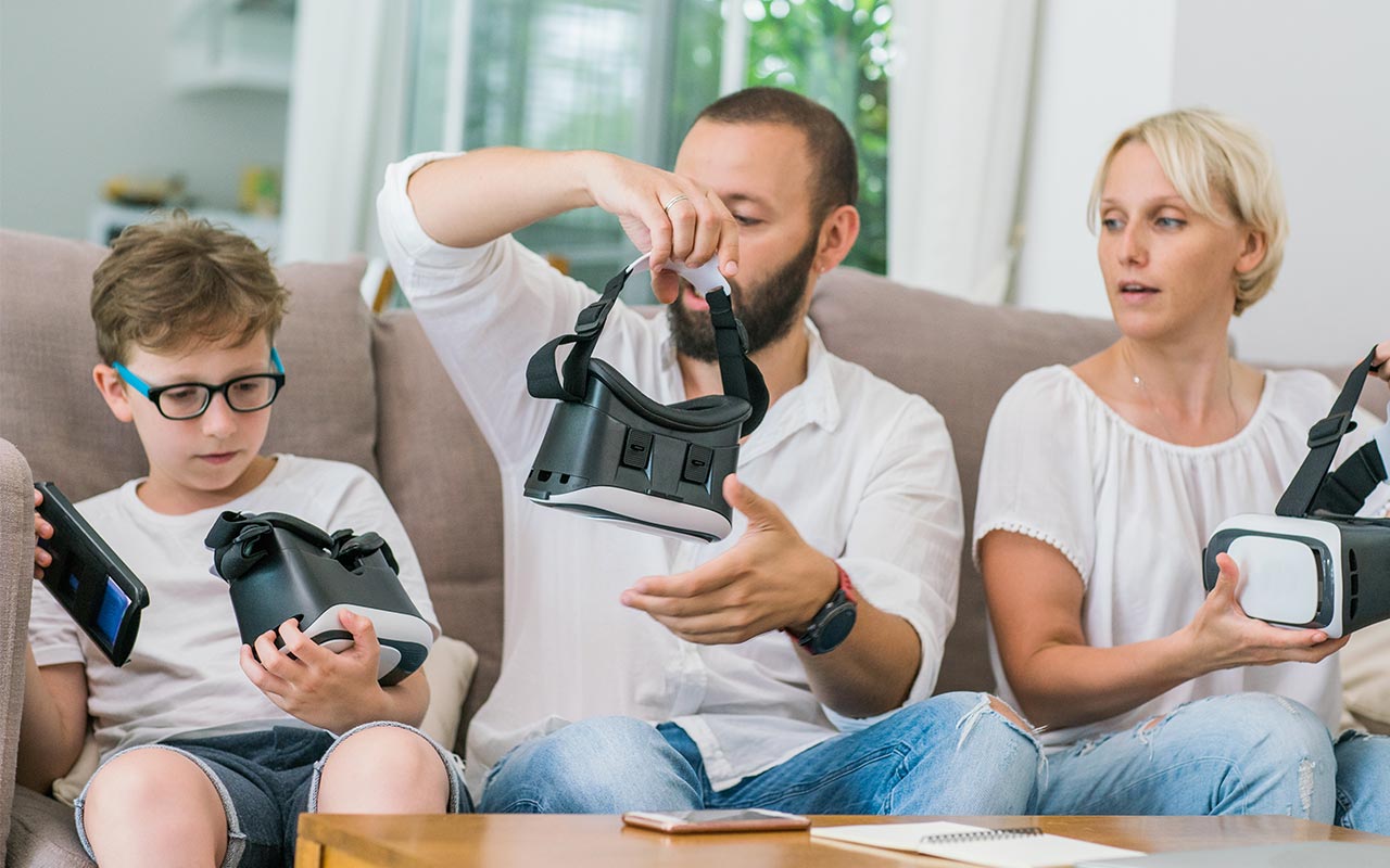 FAmily with VR headsets | Karina Urmantseva/Getty Images