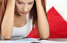 Young woman stressed over bills