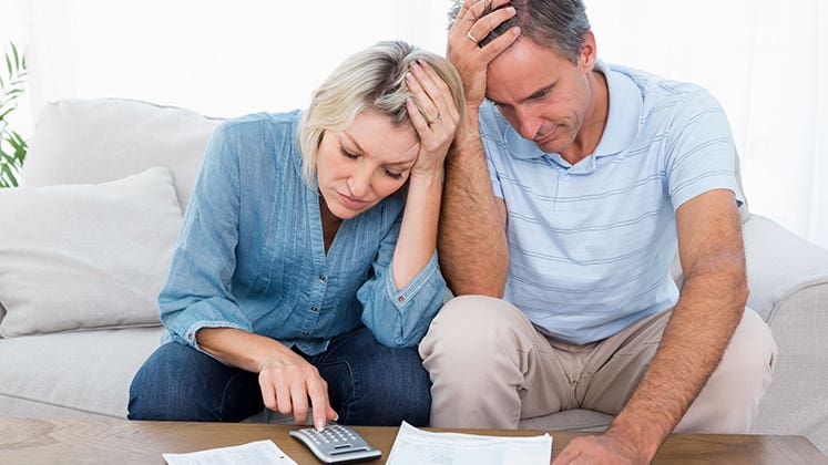 Worried couple going over finances