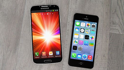 Samsung mobile phone and iPhone on a table © Pedro II/Shutterstock.com