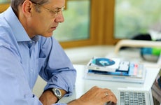 Older man at laptop © Dean Drobot/Shutterstock.com