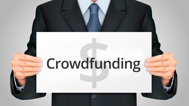 Businessman holding up crowdfunding sign © iStock