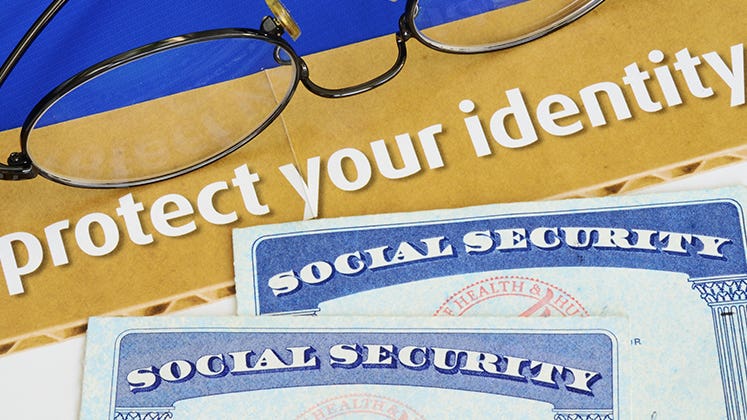 Social Security cards with protect your identity document © JohnKwan/Shutterstock.com