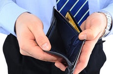Businessman holding empty wallet © Temych - Fotolia.com