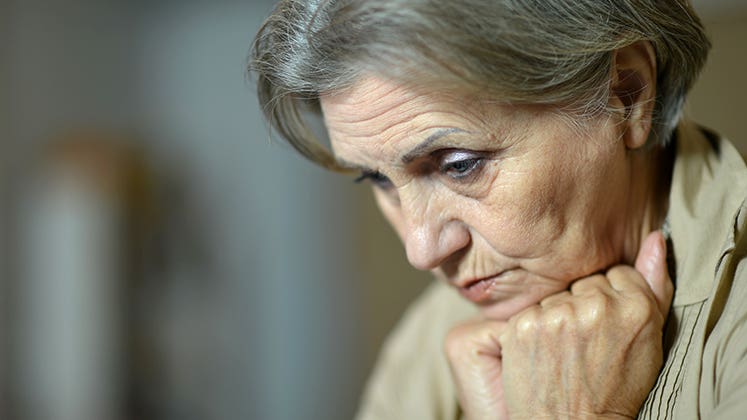 Sad senior woman at home © Ruslan Guzov/Shutterstock.com