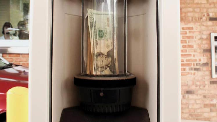 Money in banking drive thru tube | fullvalue/GettyImages