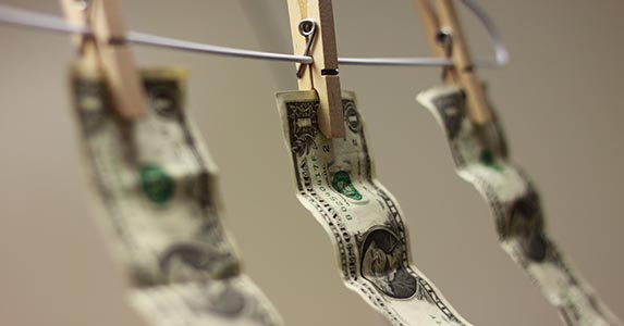Defacing U.S. currency | Jesse D. Eriksen/Moment/Getty Images