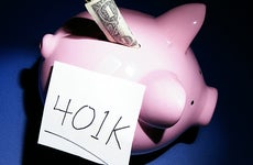 Piggy bank with dollar and 401k © zimmytws/Shutterstock.com