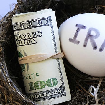 IRA nest egg with roll of cash © Don Mammoser/Shutterstock.com