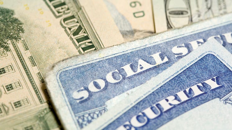 Social security cards and money © iStock
