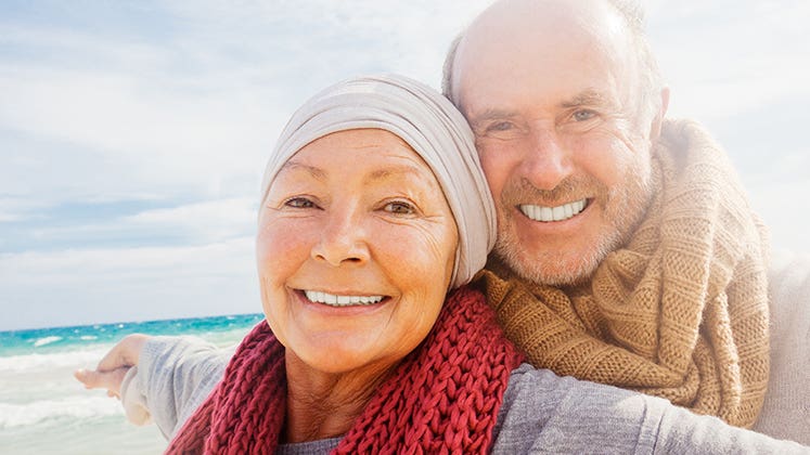 Happy senior couple at the beach © altafulla/Shutterstock.com
