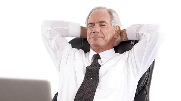 Mature, relaxed businessman reclining on chair with hands behind his neck © Straight 8 Photography/Shutterstock.com