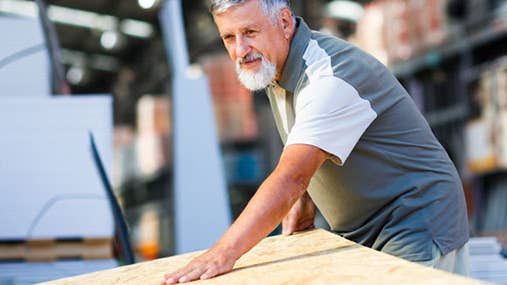 Senior man in home improvement store © l i g h t p o e t/Shutterstock.com