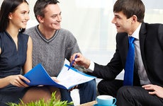 Couple listening to adviser explanation © Pressmaster/Shutterstock.com