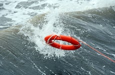 Life preserver in middle of the ocean © iStock