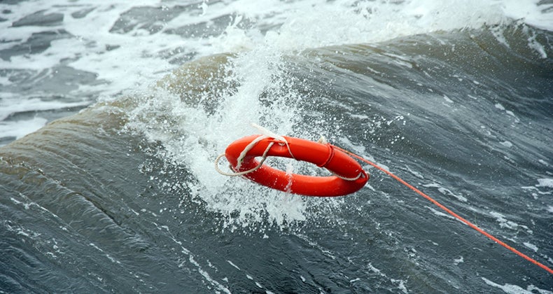 Life preserver in middle of the ocean © iStock