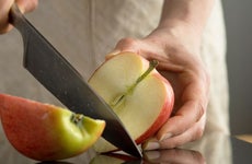woman cutting apple