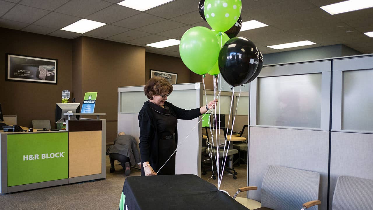H&R Block tax preparer opens the store for the day
