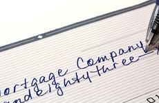 Check written to mortgage company for payment © AR Images - Fotolia.com