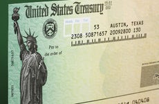 Tax refund check with green background © karen roach/Shutterstock.com