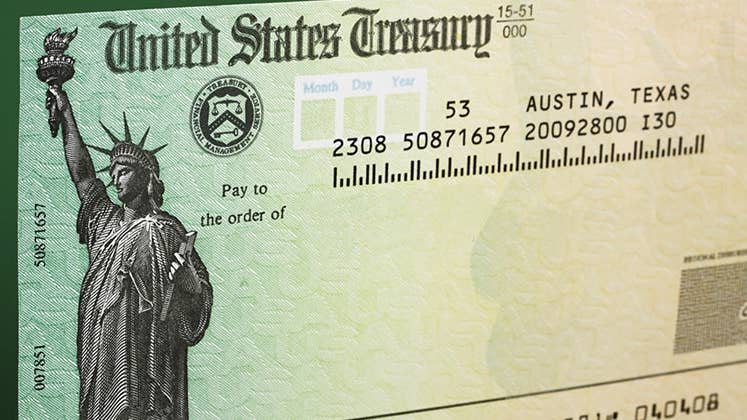 Tax refund check with green background © karen roach/Shutterstock.com