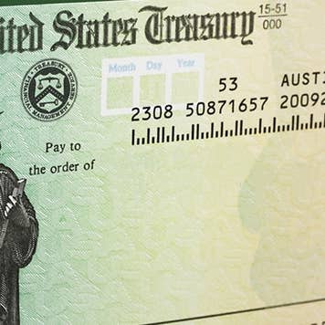 Tax refund check with green background © karen roach/Shutterstock.com