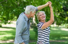 Seniors dancing outside | wavebreakmedia/Shutterstock.com