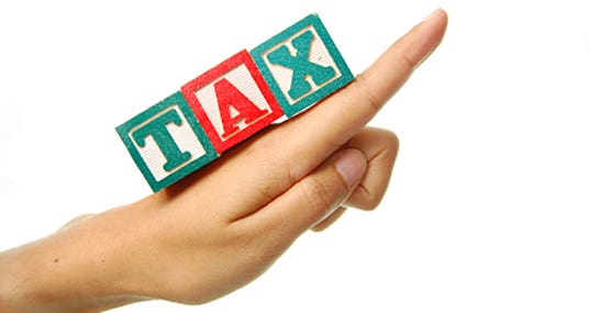Hand pointing upwards with word "tax" spelled