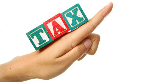 Hand pointing upwards with word &quot;tax&quot; spelled 